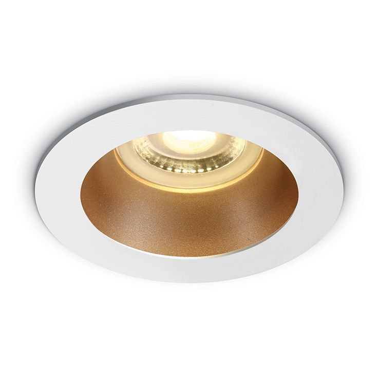 a white downlight with gold trim