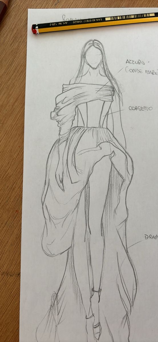 a pencil drawing of a woman's dress on top of a piece of paper