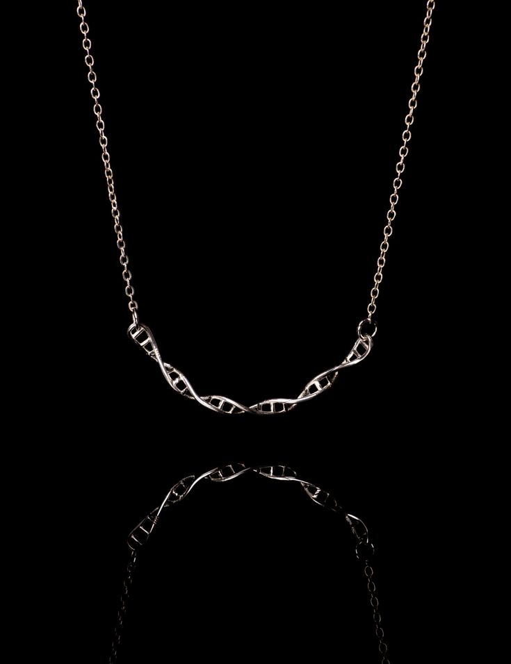 This dainty, elegant DNA double helix necklace is designed to celebrate Barbara McClintock's achievement in genetics research.  Our DNA has just four different types of base molecules but has billions of them in a sequence that is completely unique to you! That is because our genes, which are sections of DNA that contain the unique set of instructions to produce one specific molecule in your body.  Do you know that we have jumping genes?  In the 1930s and 40s, Barbara McClintock's work showed th Biomedical Scientist, Barbara Mcclintock, Dna Necklace, Molecule Necklace, Women In Stem, Scientist Gifts, Jump Around, Double Helix, Necklace Sizes