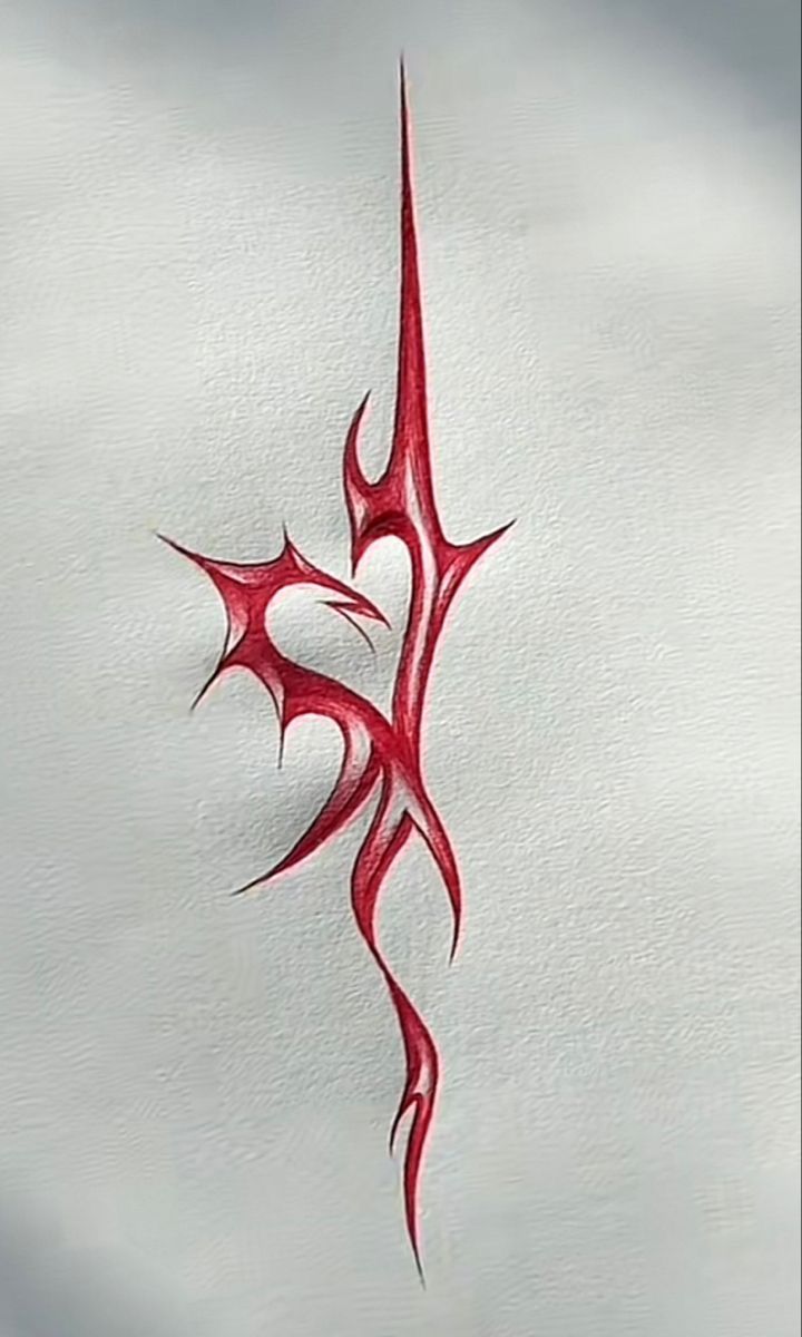 a red tattoo design on the side of a white wall with clouds in the background