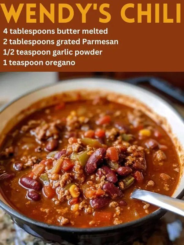 a bowl filled with chili and beans on top of a table