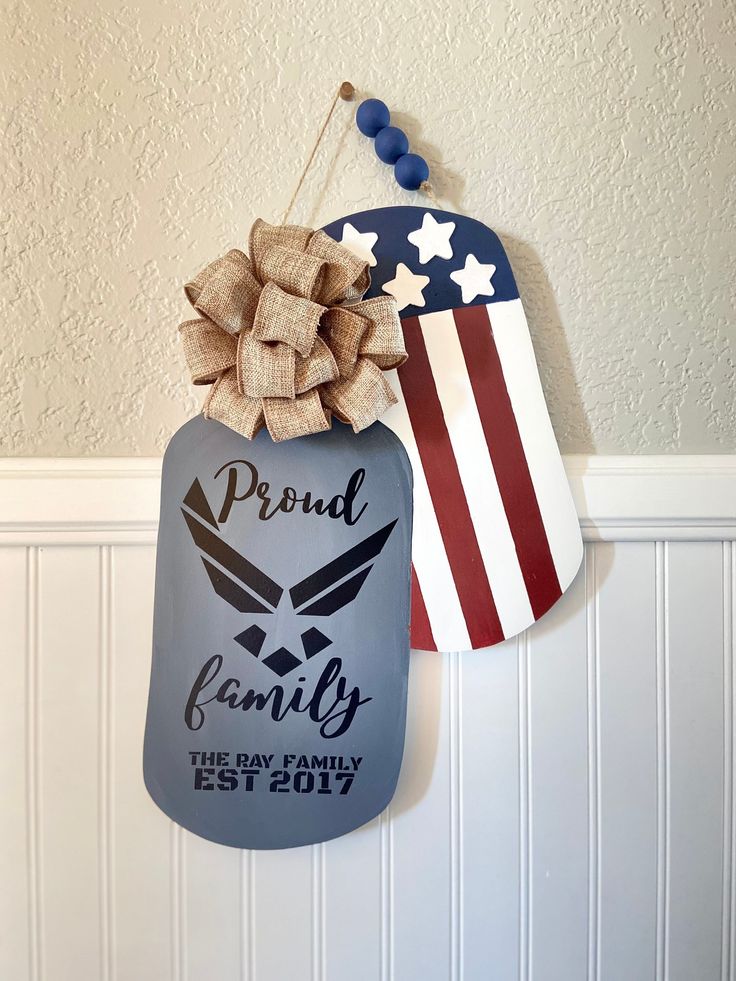 an air force memorial plaque hangs on the wall next to a patriotic hat and flag