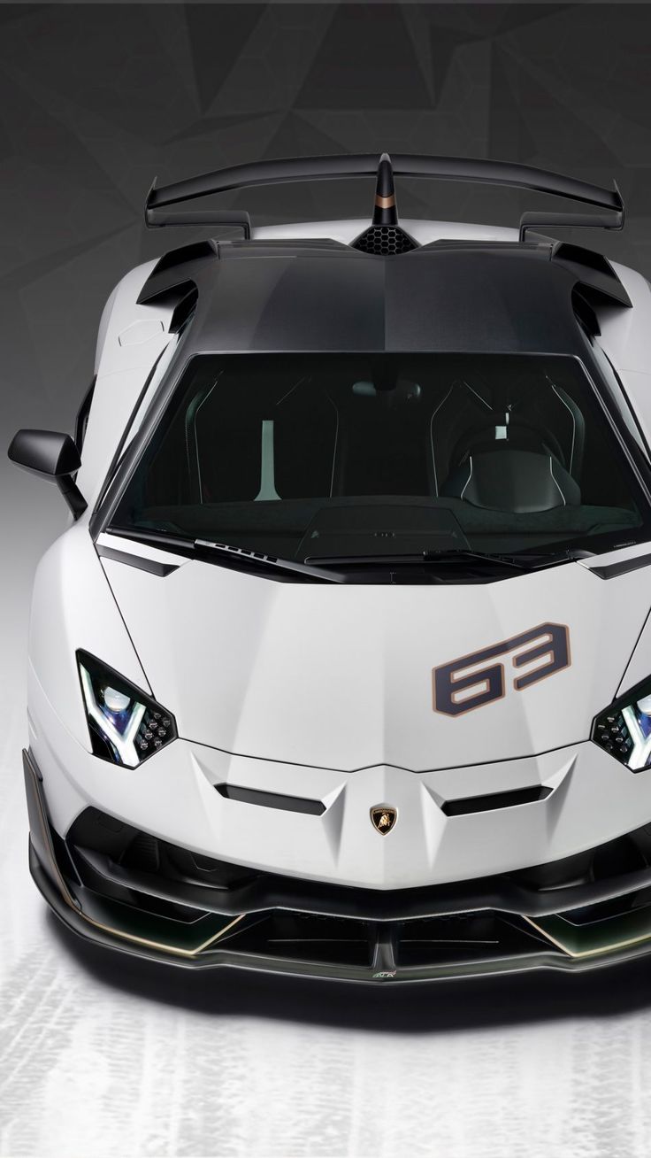 the front end of a white sports car