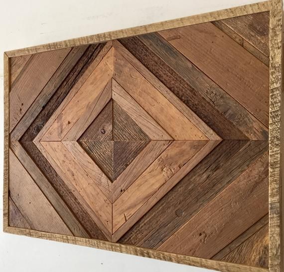 a wooden wall hanging made out of wood planks