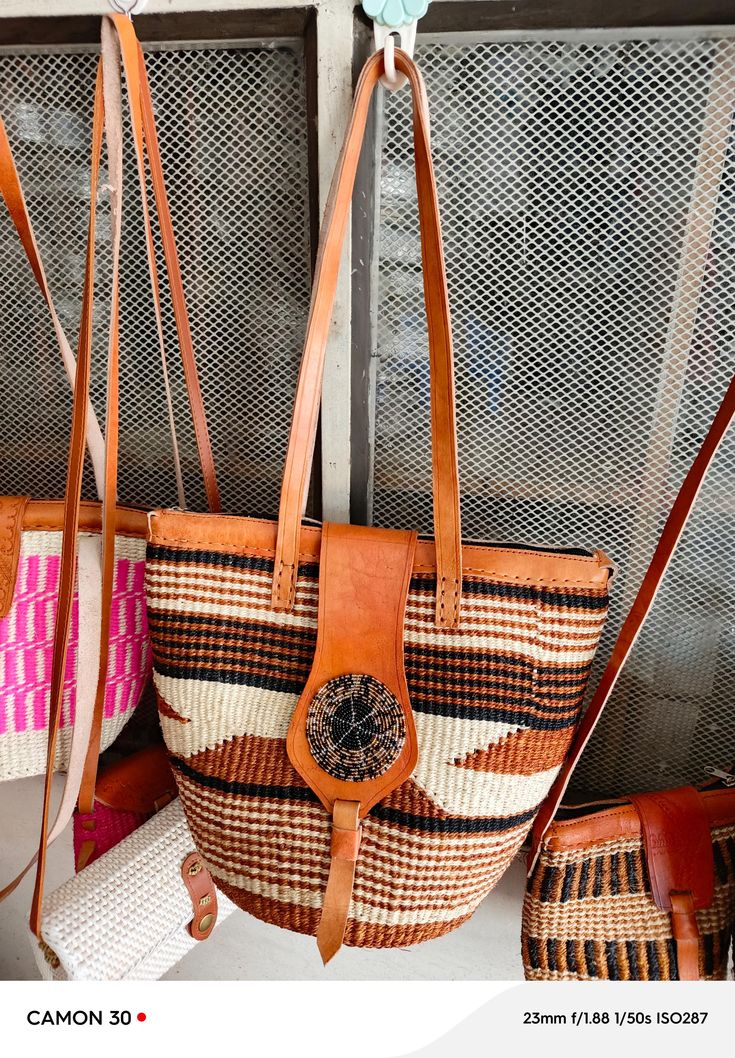 You don't have to be a millionaire to elevate your style and fashion, you need creativity and Arts. We African 1 Stores offers to you the most modern hand made tote bag woven 100% from sisal with Quality leather straps locally tunned from cows.  These beautiful handmade Tote bag originated from craftsmen living in Eastern Community in Kenya, the Akamba. Our Tote bags are woven using colored sisal and leather.The woven bag is made from products which are entirely eco-friendly and sustainable, lea Woven Beach Bag, Woven Beach Bags, Natural Sisal, Handmade Tote, Woven Tote Bag, Tote Bags Handmade, Woven Bag, Summer Travel, Womens Tote