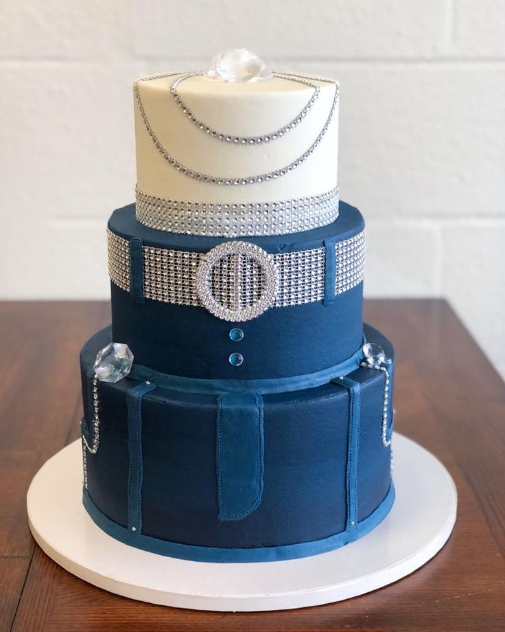 a three tiered blue and white wedding cake