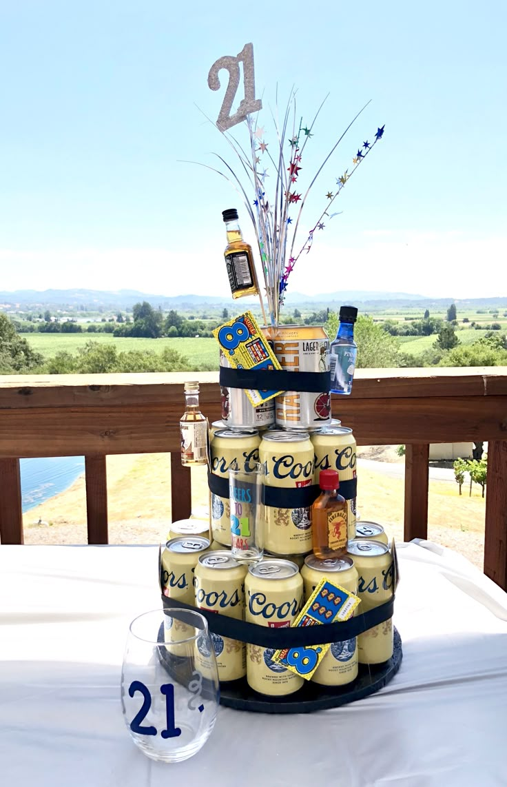 a cake made out of beer cans on top of a table