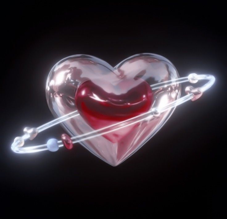 a heart shaped object with two strings attached to it's sides and an arrow in the middle