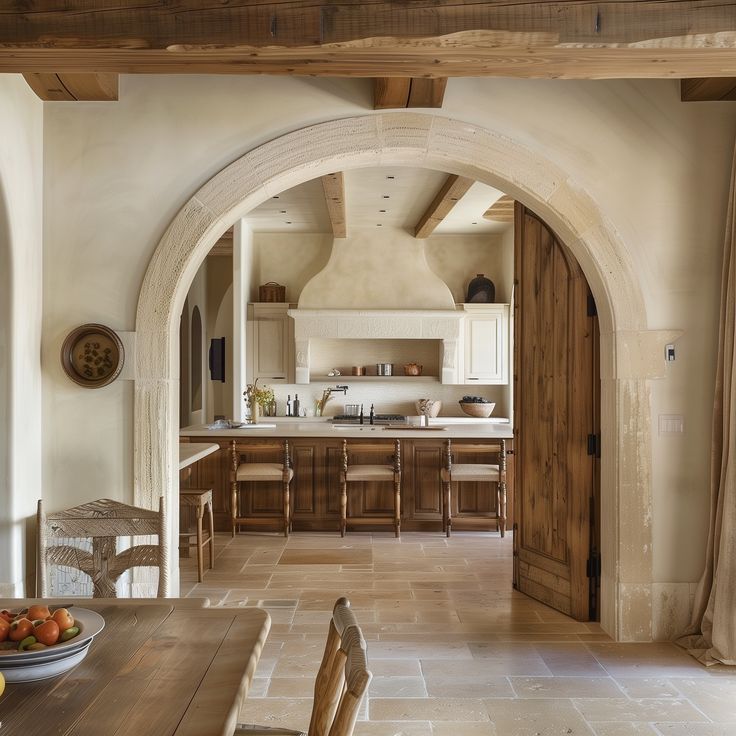 an archway leads into the kitchen and dining room in this country style home, which has been recently renovated