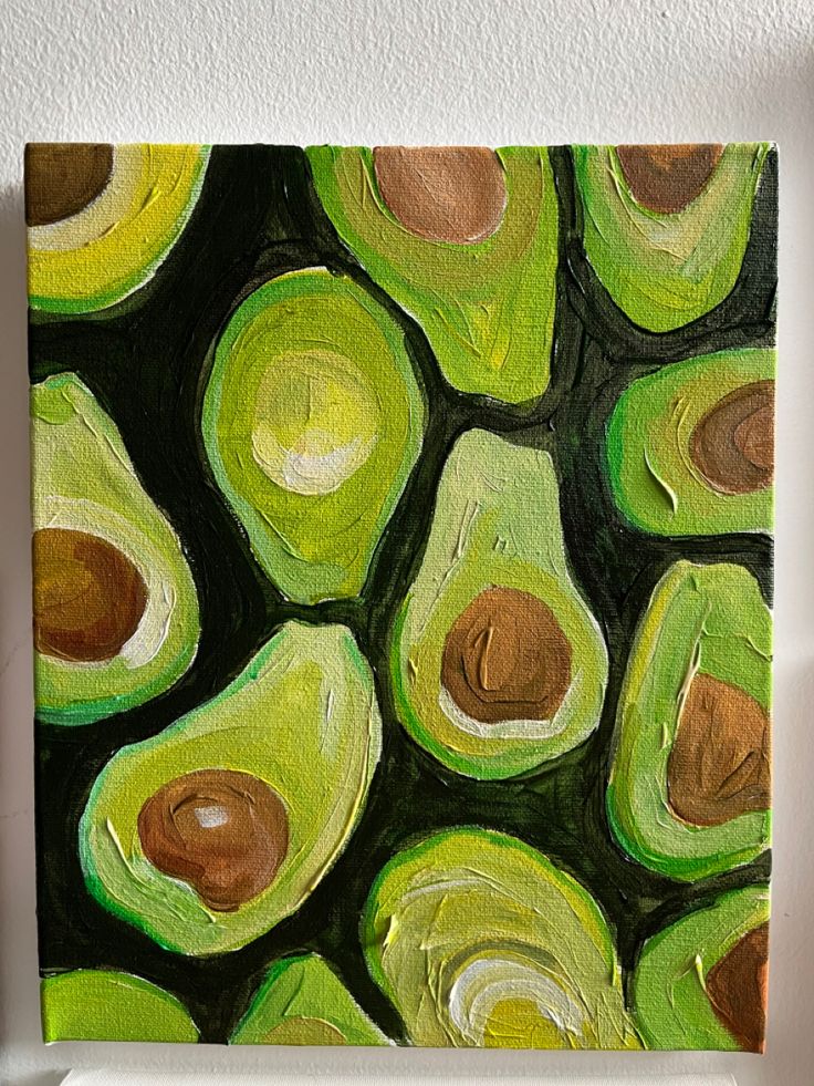 an acrylic painting of avocados in green and brown on a white wall