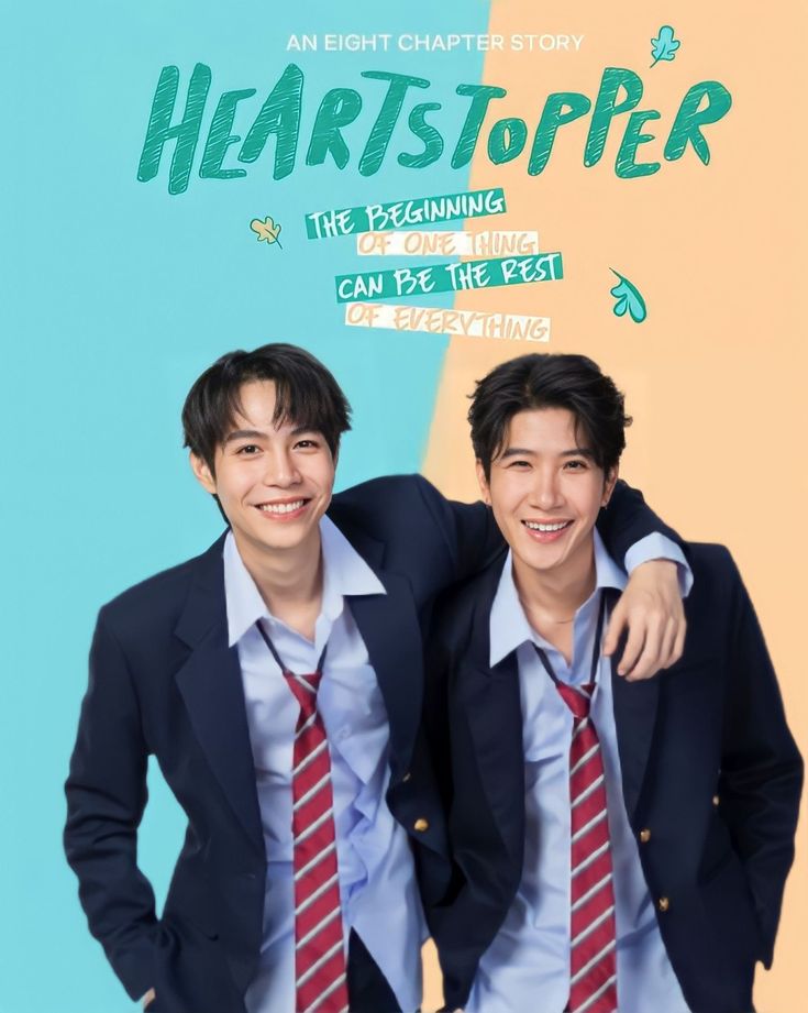 two young men standing next to each other in front of a poster for heartstopper