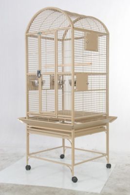 a beige bird cage sitting on top of a table