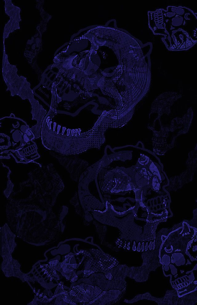 a bunch of skulls that are in the dark