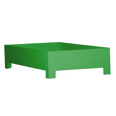 a large green box sitting on top of a white floor