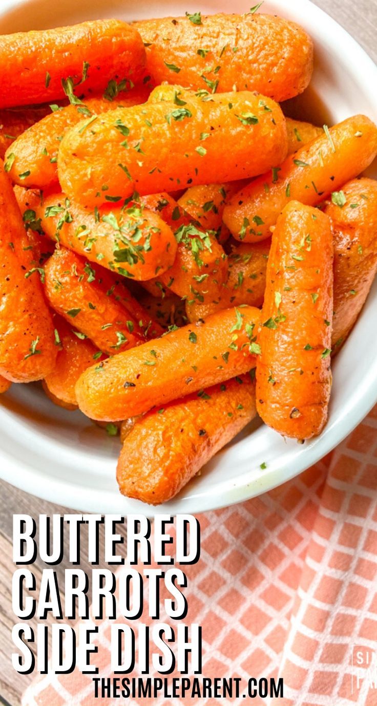 a bowl filled with carrots sitting on top of a table