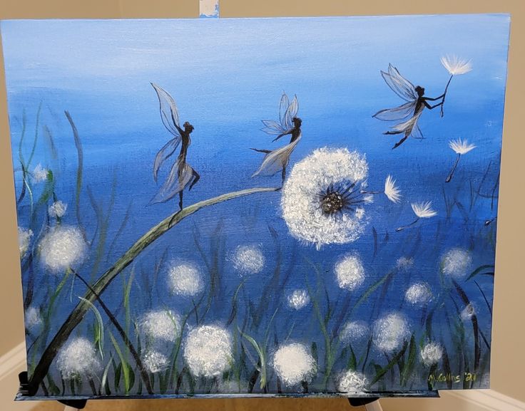 an easel painted with dandelions and white flowers