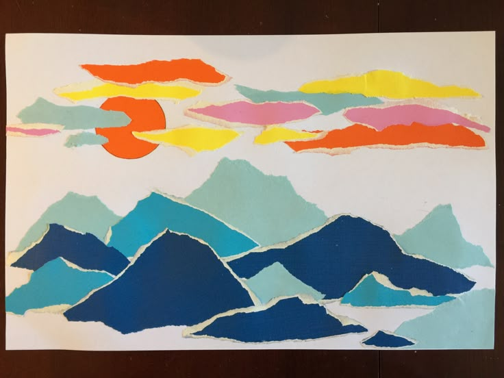 a piece of paper that has been cut into mountains