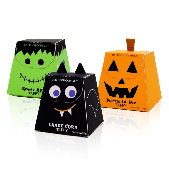 three halloween treat boxes with faces on them