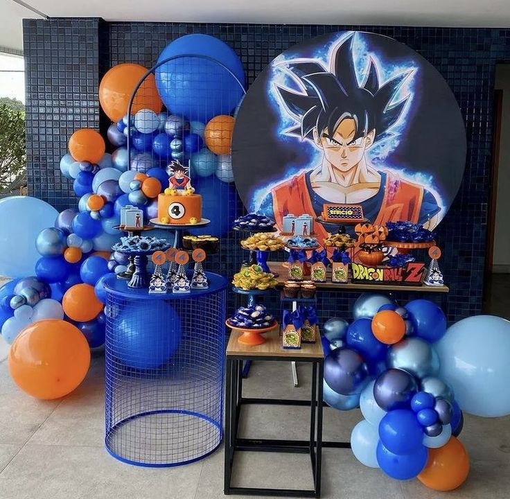 balloons and decorations are on display in front of a wall with an image of gohan