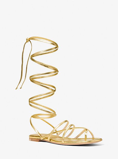 These barely-there lace-up sandals are a glamorous way to ground dresses and skirts. Crafted in Italy from metallic leather, they feature a flat leather sole for ease of wear. Chic Metallic Sandals For Summer, Metallic Strappy Sandals For Spring, Chic Flat Heel Lace-up Sandals For Party, Spring Metallic Strappy Sandals, Chic Flat Lace-up Sandals For Party, Gold Lace-up Sandals For Evening Summer Wear, Luxury Metallic Sandals For Spring, Chic Metallic Sandals For Spring, Luxury Lace-up Sandals For Spring