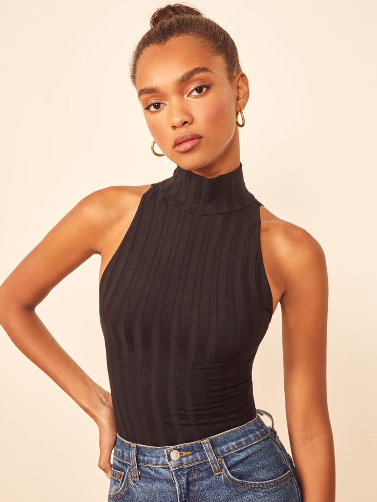 Bye sleeves. This is a slim fitting bodysuit with a turtleneck and no sleeves. The Isabel pairs well with the Cynthia High Relaxed Jean. No Sleeve Turtleneck Outfit, Turtleneck No Sleeves, Black Turtleneck Outfit, Outfit Ideas Black Women, Outfit Ideas Black, Mary Dress, Women Bodysuit, Cool Outfit Ideas, Knitted Turtleneck