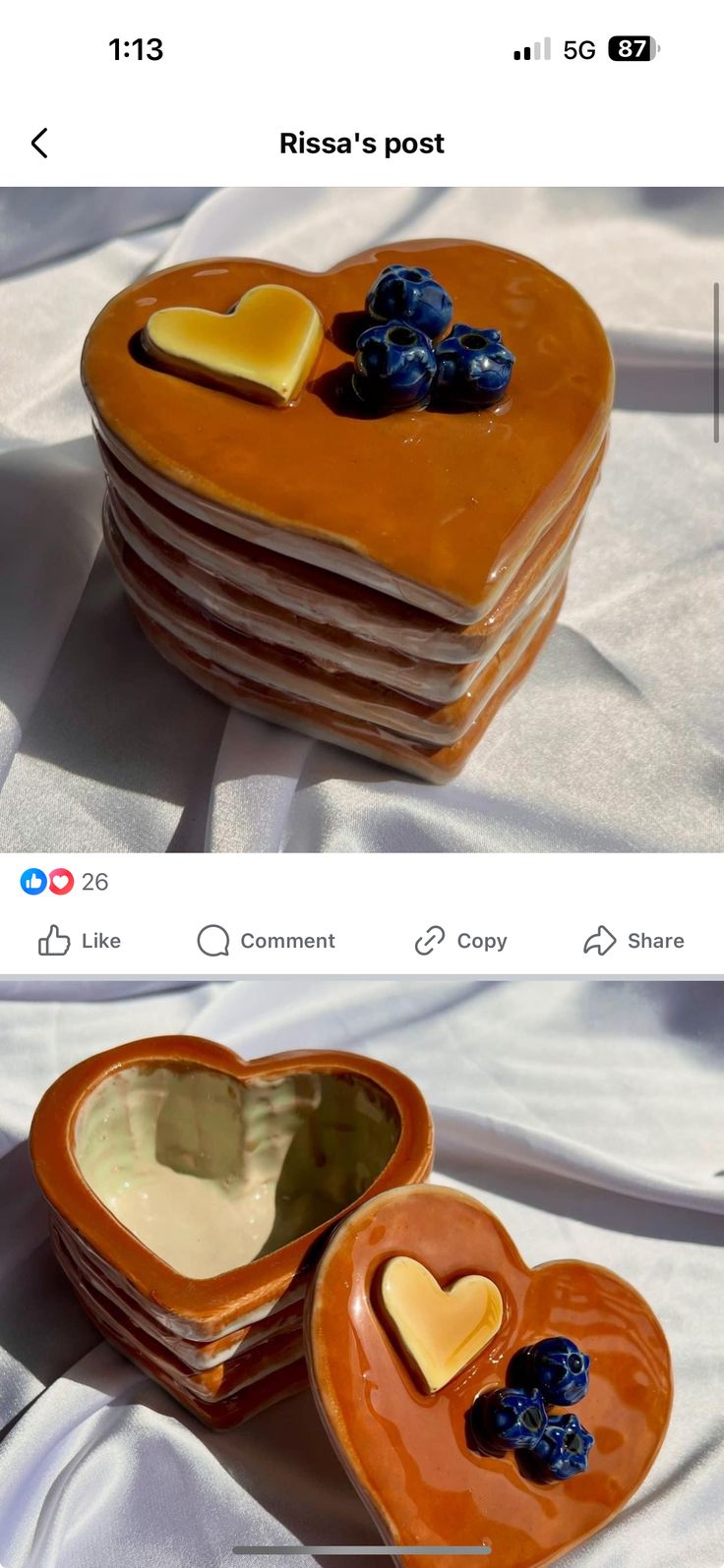 two pictures of heart shaped plates with blueberries and cheese in them on a bed