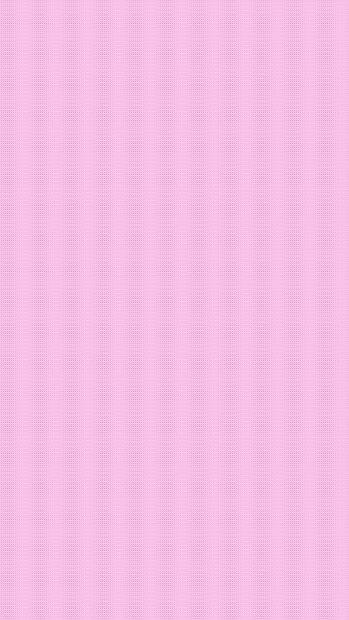 a pink background with an orange cat sitting on top of it