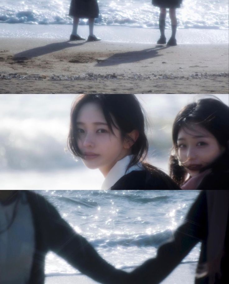 two girls standing on the beach with their hands in each other's pockets and looking at the water