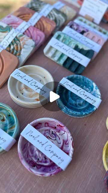 a table topped with lots of different colored plates