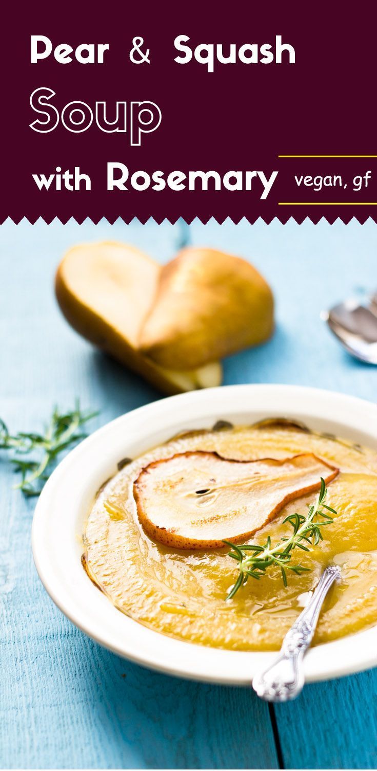 pear and squash soup with rosemary garnish in a white bowl on a blue table