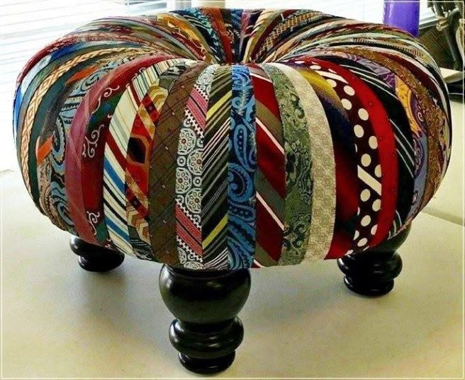 an ottoman made out of ties sitting on top of a table