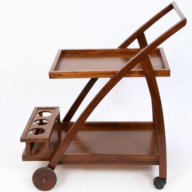 a wooden serving cart with two trays on wheels