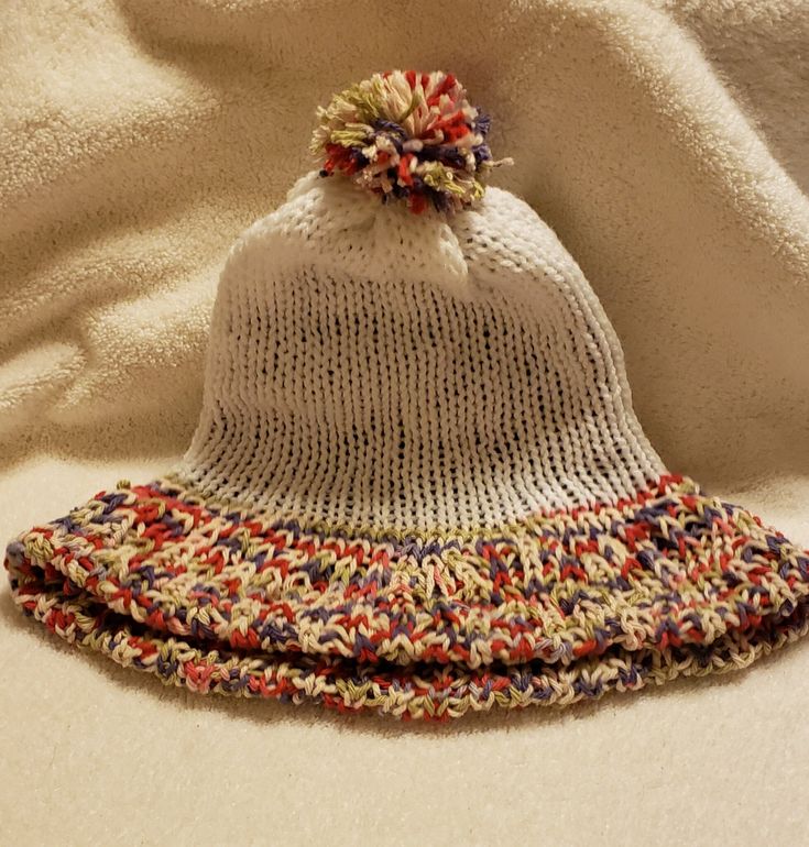 Bell-shaped beanie made from cotton yarn with a pompom Casual Knitted Beanie Mini Hat, Casual Knitted Mini Beanie Hat, Casual Knitted Mini Cap Hat, Casual Knitted Mini Cap, Casual Yarn Mini Hats For Winter, Casual Knitted Mini Hats One Size, Playful Cotton Winter Hat, Warm Cotton Playful Hat, Playful Warm Cotton Hat