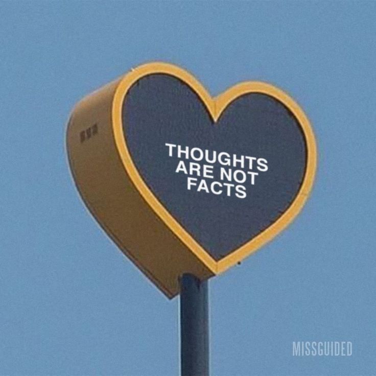 a heart shaped sign with the words thoughts are not factts on it's side