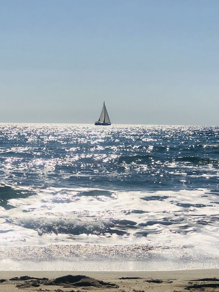 a sailboat is out on the ocean