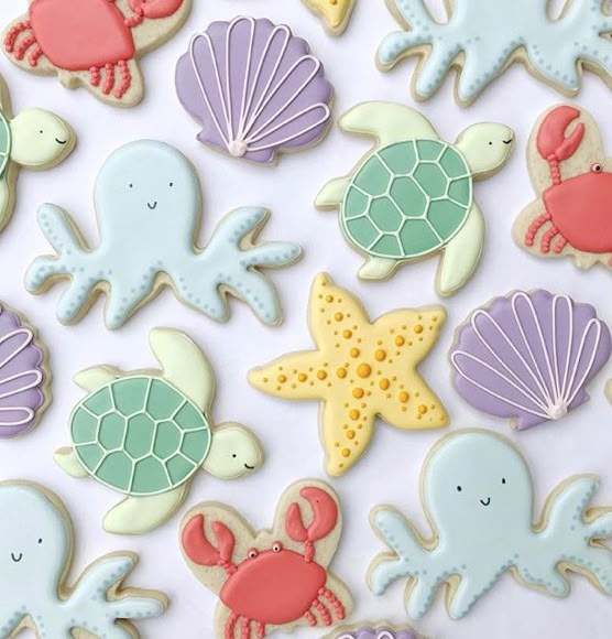 decorated cookies with sea animals and seashells on them