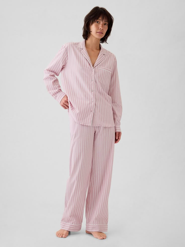 Soft cotton poplin pajama pants.  Elasticized waist.  Certain styles have allover prints.  * Fit: Classic.  An easy silhouette that fits close  at the waist, and is relaxed through the hips and thigh.  Models wearing Gap Pink Plaid Pajamas, Cute Casual Pajamas, Skims Pajamas Pink, Holiday Matching Pajamas, Pink Striped Pajamas, Long Pajama Set, Pajamas For Winter, Winter Pajama Set, Punk Pajamas