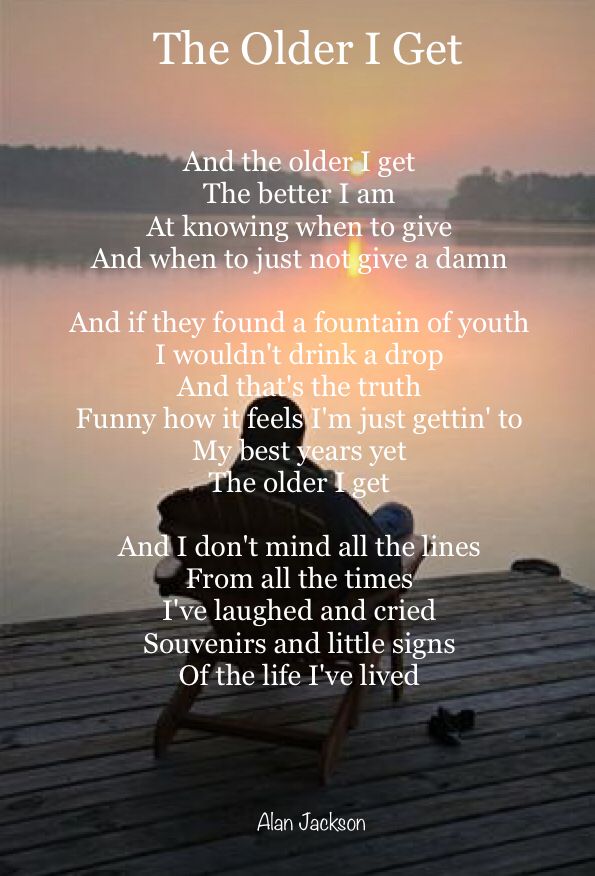 a person sitting on top of a wooden dock next to the water with a poem written in