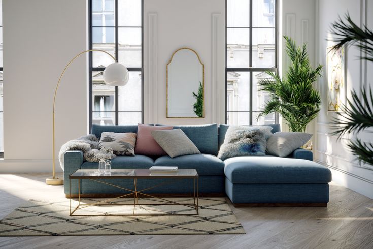 a living room filled with furniture and lots of windows