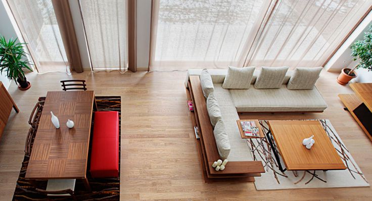 an aerial view of a living room and dining area