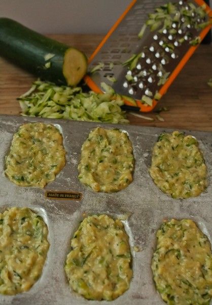 the muffins are ready to be baked in the oven with zucchini sprouts