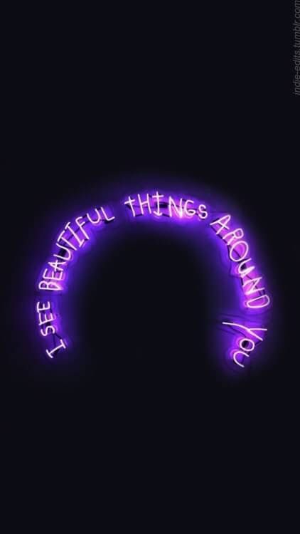 the words are lit up in purple light