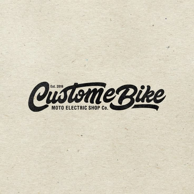 a close up of a logo on a piece of paper with the words custom bike