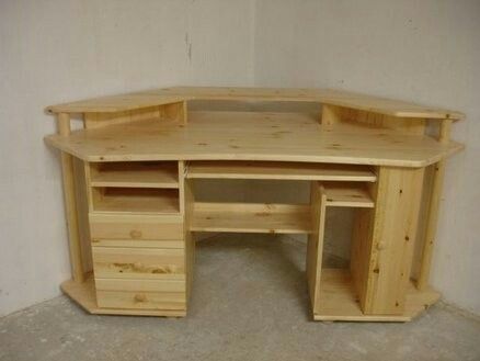 a corner desk with drawers and shelves on the bottom shelf is made out of pine wood