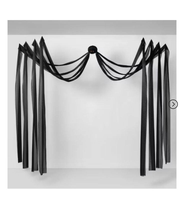 an image of a black curtain that is hanging on the wall