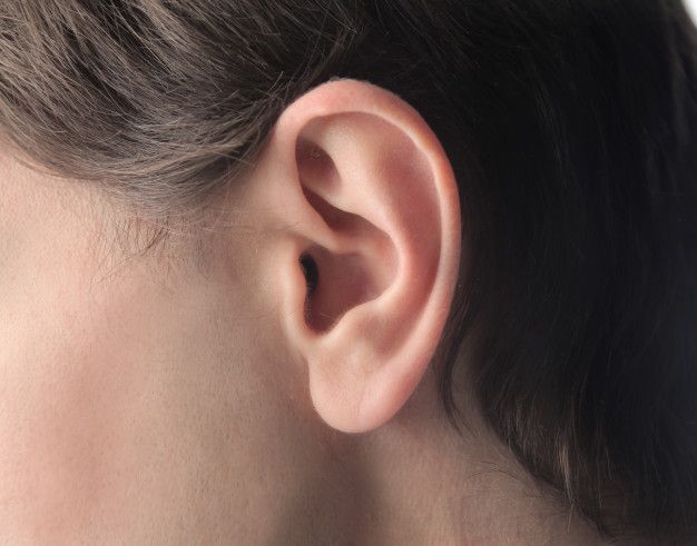 a woman's ear is shown from the side