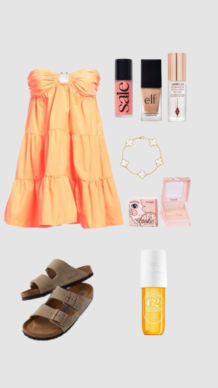 an orange dress, sandals and other items are arranged on a gray background