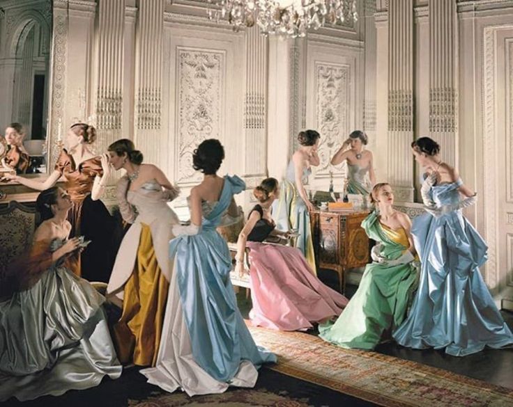 a group of women dressed in evening gowns