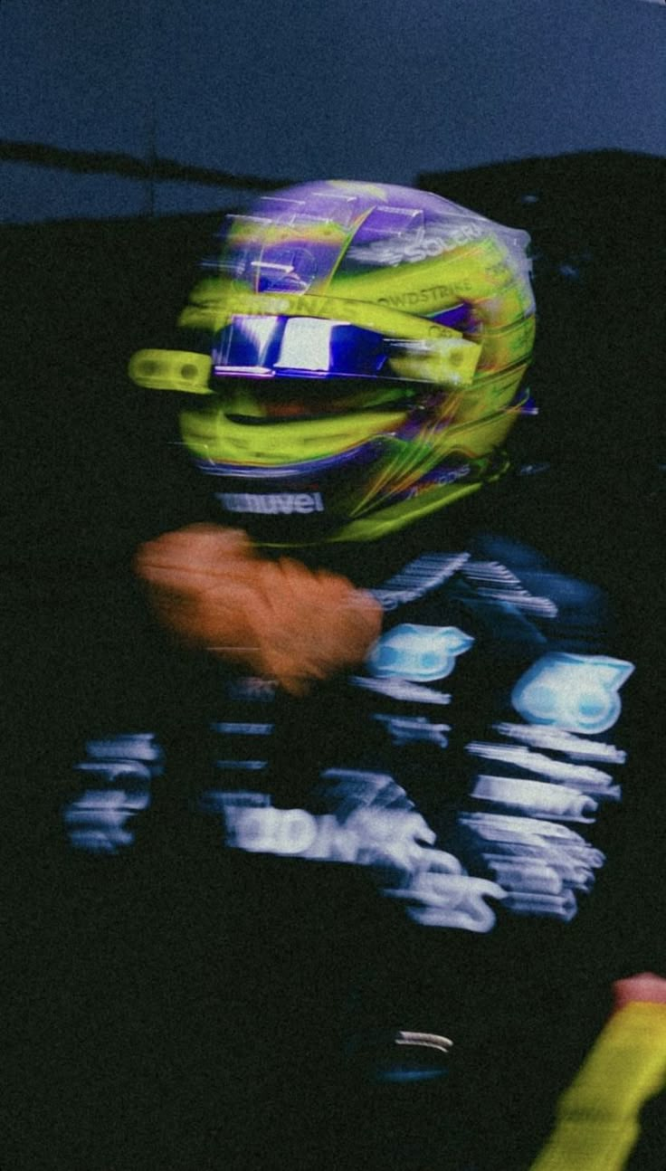 blurry photograph of a person wearing a helmet