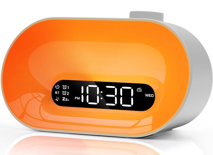 an orange alarm clock with the time on it's display is shown in front of a white background